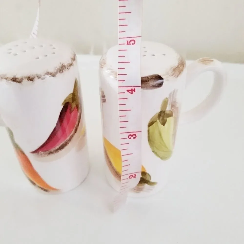 Vintage salt and pepper shakers with hot peppers